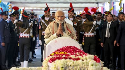 India's Prime Minister Narendra Modi (C) pays last respect to his late predecessor Manmohan Singh during the state funeral ceremony in New Delhi. A state funeral with full military honours, complete with a gun salute. AFP