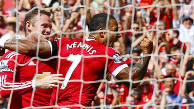 Memphis Depay, with Wayne Rooney. Action Images