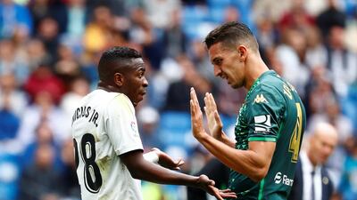 Real Madrid's Vinicius Junior and Real Betis' Zouhair Feddal remonstrate with each other. Reuters