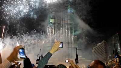 Spectators line up for the New Year's Eve fireworks display at the Burj Khalifa in Dubai. Jeff Topping / The National