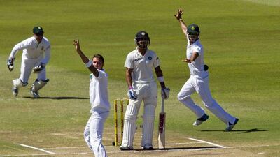 South Africa’s AB de Villiers, left, Dale Steyn and JP Duminy, right, appeal successfully for the wicket of India’s Virat Kholi on Day 5 of the second Test in Durban on Monday. Rogan Ward / Reuters