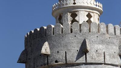 Topped by its decorative cupola, the imposing north-east tower of Qasr Al Hosn, known as Burj Al Hamam, or Tower of the Pigeons, has been stripped of its white render but its grey undercoat remains. Future conservation works will remove this layer as well to expose the tower’s original structure before a new render of traditional materials is applied. Christopher Pike / The National