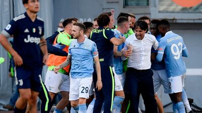 Lazio celebrate their injury-time equaliser from Felipe Caicedo. AFP