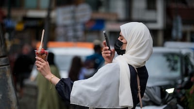 A tourist takes a picture of a dessert on Krupowki