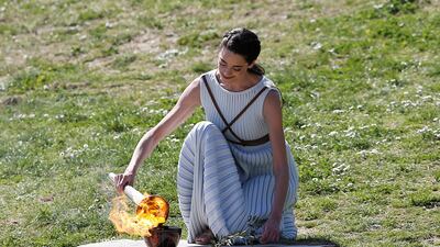 Greek actress Xanthi Georgiou, playing the role of High Priestess lights the flame during the Olympic flame lighting ceremony for the Tokyo 2020 Summer Olympics in Ancient Olympia, Greece. Reuters