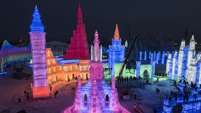 Chinese labourers work on large ice sculptures in preparation for the Harbin Ice and Snow Festival. Getty Images