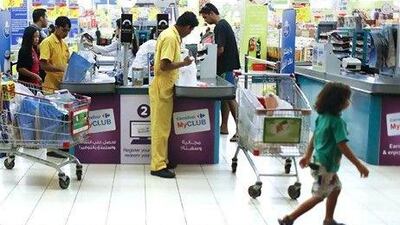 A basket of nine branded goods, including Coca-Cola, Nescafé instant coffee and Lurpak butter, is now more expensive at three local hypermarkets. Sarah Dea / The National