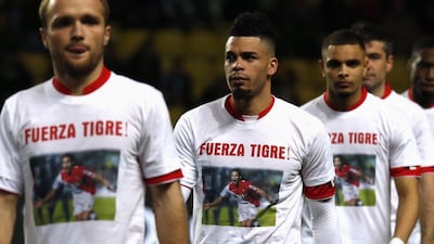 Valere Germain, left, Emmanuel Riviere, centre and the rest of Monaco came out in 'Fuerze Tigre' ('Strength Tiger') shirts for injured Radamel Falcao on Sunday. Germain and Riviere both scored in the win. Eric Gaillard / Reuters