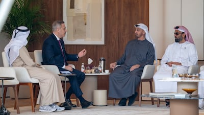 The President and Mr Fidan with Sheikh Tahnoon bin Zayed, Deputy Ruler of Abu Dhabi and National Security Adviser, right, and Ali Mohamed Hammad, Secretary General of the UAE Supreme Council for National Security