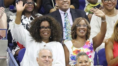 US television personality Oprah Winfrey, left, and Gayle King watch Serena and Venus Williams during their US Open quarter-final match on Tuesday. Andrew Gombert / EPA