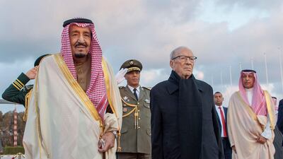 Essebsi posing for a picture during a welcoming ceremony at Tunis-Carthage International Airport with Saudi Arabia's King Salman. AFP Photo