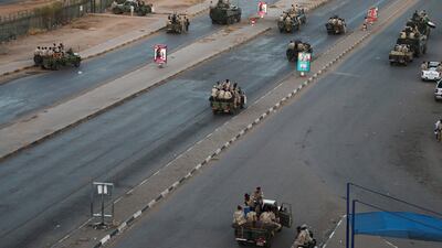 Members of the Rapid Support Forces, a paramilitary force operated by the Sudanese government, block roads in Khartoum. AP Photo