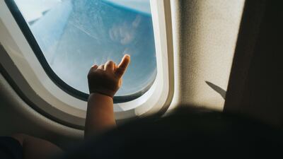 In-flight entertainment is a parent's best friend when flying with unruly children. Getty Images