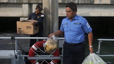 Malaysian navy personnel prepare food supplies for Myanmar and Bangladesh migrants they found while patrolling Langkawi, Malaysia on May 15. Malaysia’s Maritime Enforcement Agency beefed up its patrols on its waters to prevent migrants from entering the country, after more than 1,000 Rohingya and Bangladeshi boat people landed in the northern island of Langkawi earlier in the week. Fazry Ismail/EPA