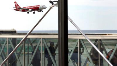 An Air Asia plane comes into land at Phuket airport. Long-haul brand Air Asia X may amend its planned Airbus order, the CEO said. EPA
