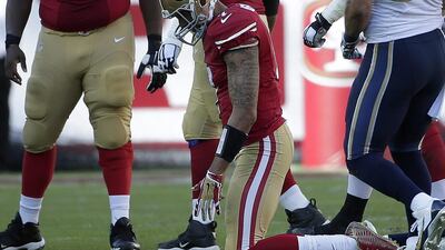 Colin Kaepernick kneels after losing a fumble in San Francisco's loss to St Louis on Sunday. Marcio Jose Sanchez / AP / November 2, 2014