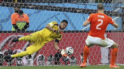 Goalkeeper Sergio Romero, left, of Argentina saves the penalty of Netherlands' Ron Vlaar during the penalty shoot-out of a World Cup 2014 semi final match between the Netherlands and Argentina at the Arena Corinthians in Sao Paulo, Brazil on July 9, 2014. EPA/Marcelo Sayao