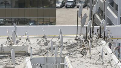 A maximum of four satellite dishes connected to a central system can be installed on roofs by building owners, according to Abu Dhabi Municipality rules. Mona Al-Marzooqi / The National