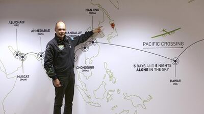 Bertrand Piccard, the initiator, chairman and pilot of Solar Impulse, points Japan on the map at the Mission Control Center for the Solar Impulse flight in Monaco yesterday. Lionel Cironneau / AP Photo