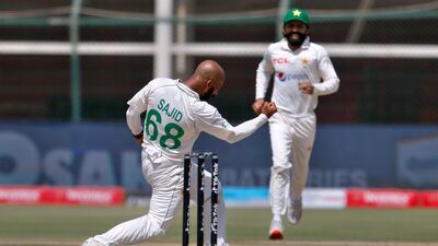 Pakistan bowler Sajid Khan celebrates after taking the wicket of Australia's Usman Khawaja. AP