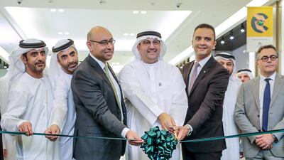 A ribbon cutting ceremony was held to mark opening day. From left to right: Ali Al Abdulla, Head of Community, Neighbourhood Malls Development & Government Affairs; Hamad Al Lawati, Community Malls Senior Manager, Majid Al Futtaim; Ahmed Galal Ismail, CEO Majid Al Futtaim - Properties; Mohamed Jameel Al Ramahi, Chief Executive Officer of Masdar, Abu Dhabi Future Energy Company; Hani Weiss, CEO Majid Al Futtaim - Retail; Ghaith Shocair, CEO Shopping Malls at Majid Al Futtaim - Properties; Khaled Abu-Nasrah, CEO Project Management Business Unit - Majid Al Futtaim - Properties. Victor Besa / The National