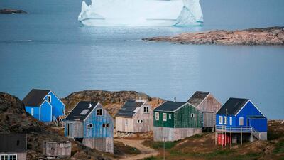 Icebergs float behind the town of Kulusuk in Greenland. AFP