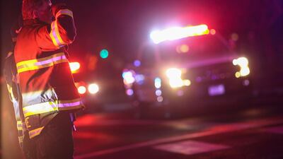First responders stand in salute as a procession of law enforcement vehicles drive past in honour of fallen Boulder police officer Eric Talley. Reuters