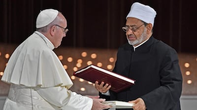 Pope Francis and Egypt's Azhar Grand Imam Sheikh Ahmed al-Tayeb greet each other after signing documents during the Human Fraternity Meeting at the Founders Memorial in Abu Dhabi in February. AFP