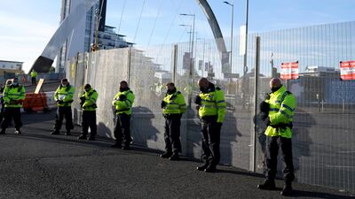 Police officers observe a two-minute silence outside the summit venue. PA