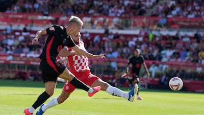 Dani Olmo scores Barcelona's third goal against Girona. EPA
