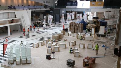 Workers get ready for the International Defence Exhibition and Conference (Idex) taking place in Abu Dhabi next week.