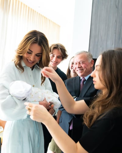Queen Rania cradles her granddaughter Princess Iman bint Al Hussein. Queen Rania / Instagram