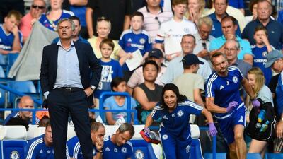 Chelsea manager Jose Mourinho looks on as team doctor Eva Carneiro rushes to treat Eden Hazard during the Premier League match between Chelsea and Swansea City at Stamford Bridge on August 8, 2015. Mike Hewitt/Getty Images