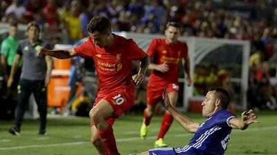 Philippe Coutinho, left, of Liverpool is tackled by John Terry of Chelsea. Jeff Gross / Getty Images