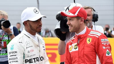 After victory at the French Grand Prix, Lewis Hamilton, left, leads Sebastian Vettel, right, by 14 points in the drivers' championship standings. Boris Horvat / AFP