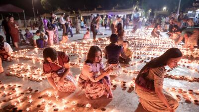 Buddhists light lamps at Botahtaung Pagoda to mark the full moon day of the Thadingyut festival in Yangon, Myanmar. AFP