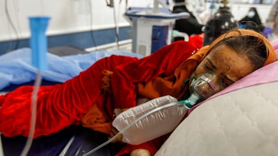 A girl who is infected with Covid-19 receives oxygen in a quarantine ward at a hospital in the holy city of Najaf, Iraq. Reuters