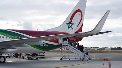 People board a Royal Air Maroc flight on July 15, 2020 at Bordeaux's airport. AFP