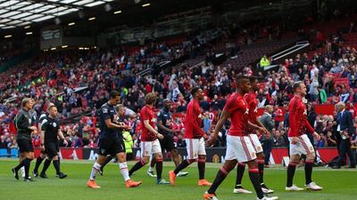 Manchester United and Bournemouth players leave the field before the match was abandoned at Old Trafford on Sunday. Alex Livesey / Getty Images / May 15, 2016