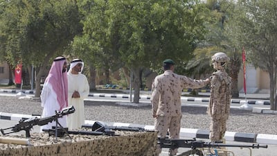 Sheikh Tahnoon bin Zayed, left, and Sheikh Nahyan bin Zayed watch a demonstration. Mohamed Al Hammadi / Crown Prince Court — Abu Dhabi