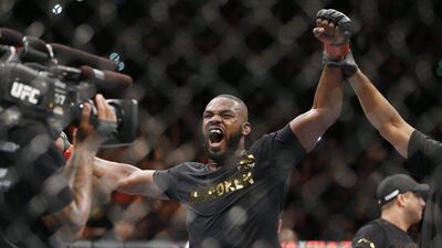 Jon Jones celebrates after defeating Daniel Cormier in their light heavyweight title bout at UFC 182 in Las Vegas on Saturday. John Locher / AP / January 3, 2015