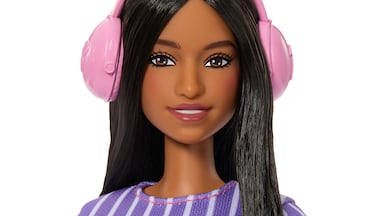 The new doll wears noise-cancelling headphones. Mattel / PA Wire