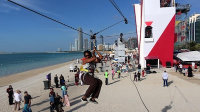 A visitor tries a zip-line on the last day of the Mother of the Nation Festival at the Corniche in Abu Dhabi. Satish Kumar / The National