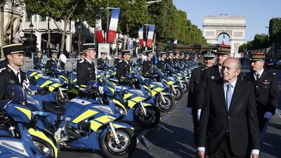 French interior minister Gerard Collomb inspects the French gendarmerie. Geoffrey van der Hasselt / AFP Photo
