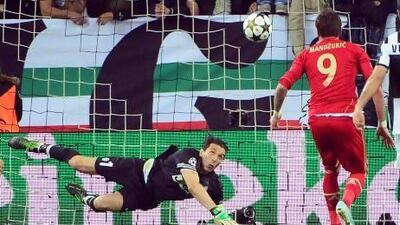 Bayern Munich's Croatian striker Mario Mandzukic scores against Juventus to send them out of the Champions League. Olivier Morin / AFP