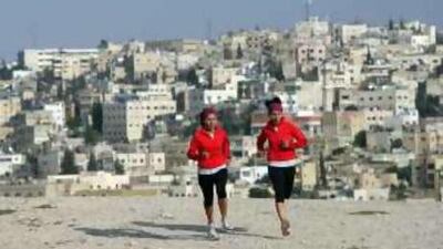 Jordanian twins Dima (left) and Lama Hattab exercise in Amman as they prepare for their latest challenge: climbing Mt Everest.