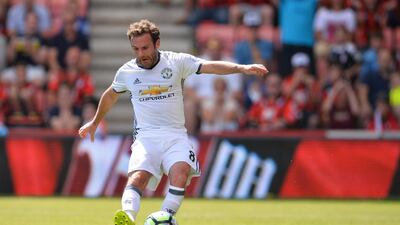 Manchester United's Spanish midfielder Juan Mata scores the opening goal against Bournemouth. Glyn Kirk / AFP