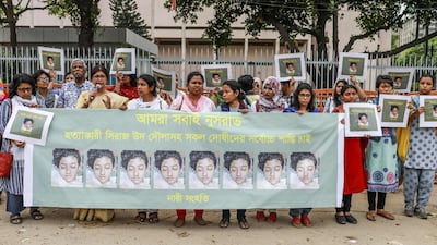 Bangladeshi women hold banners and photographs of schoolgirl Nusrat Jahan Rafi at a protest in Dhaka, following her murder. AFP / Sazzad Hossain