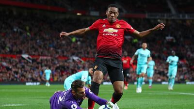 Martin Dubravka of Newcastle United and Anthony Martial of Manchester United vie for the ball. Getty Images