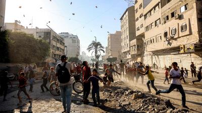 The Israeli military drops leaflets ordering Palestinians to leave Gaza city. AFP